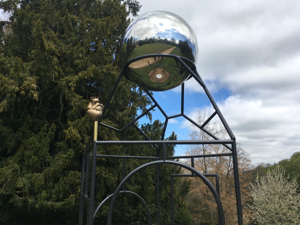 THe Gazing Ball at the Rotondo. Lucy and Jorge Orta's Gazing Ball dazzles with a mirror-like shine reminiscent of the mon ponds in the valley below. The artwork references the architectural details of the former Rotondo folly.